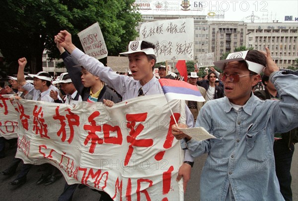 Belgrade,yugoslavia, may 9 2001, in response to the bombing of the chinese embassy in belgrade, about 200 young chinese rally in downtown belgrade on sunday demanding to end the nato`s bombing of yugoslavia.