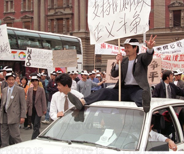 Belgrade,yugoslavia, may 9 2001, in response to the bombing of the chinese embassy in belgrade, about 200 young chinese rally in downtown belgrade on sunday demanding to end the nato`s bombing of yugoslavia.