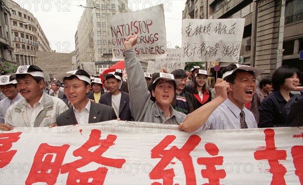 Belgrade,yugoslavia, may 9 2001, in response to the bombing of the chinese embassy in belgrade, about 200 young chinese rally in downtown belgrade on sunday demanding to end the nato`s bombing of yugoslavia.