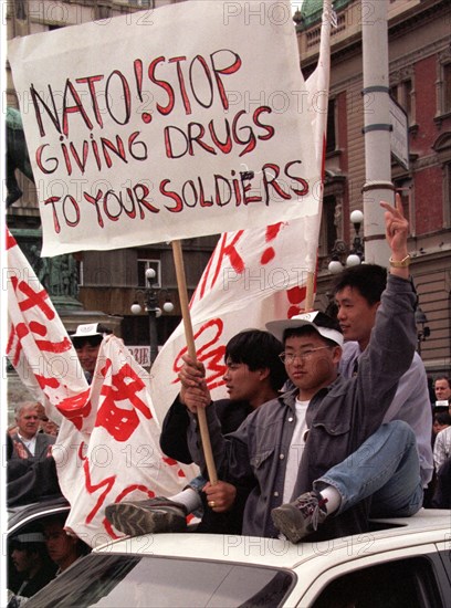 Belgrade,yugoslavia, may 9 2001, in response to the bombing of the chinese embassy in belgrade, about 200 young chinese rally in downtown belgrade on sunday demanding to end the nato`s bombing of yugoslavia.