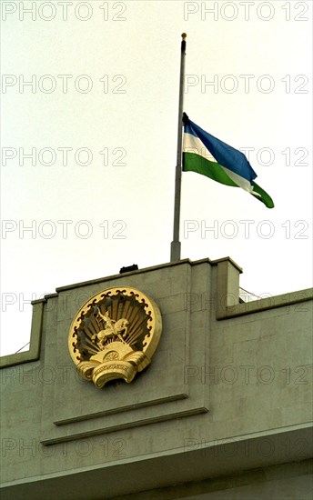Ufa, bashkortostan, russia, july 2 2002: the flag flies half-mast at the bashkortostan government building, as the republic mourns victims of the bashkir airlines plane crash, the tu-154 liner of bashkirairlines flew to spain last night and later collided with a boeing-757 over germany, killing 71 passengers, 52 of them children.