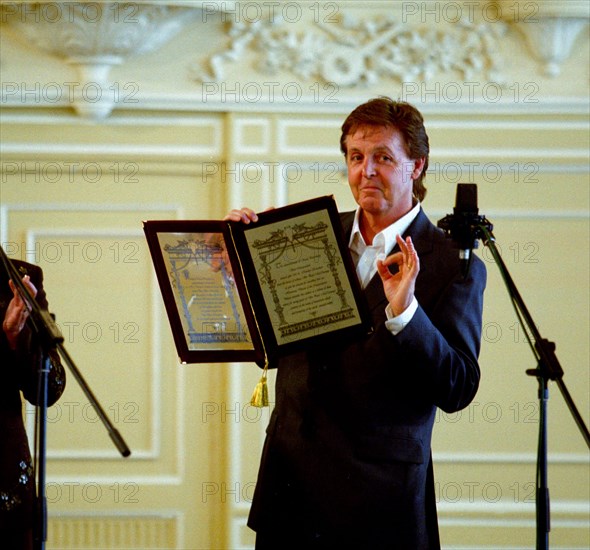Sir paul mccartney, the famous british musician, and a former beatle, receives the award of honorary doctor of music at the st,petersburg conservatory, st, petersburg, russia, 5/03.