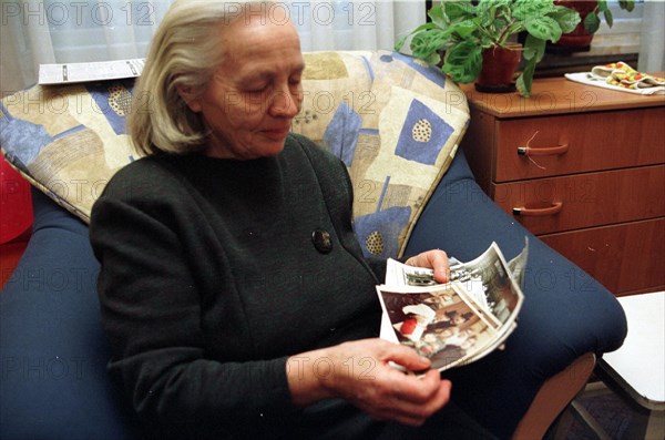 Yekaterina shkrebneva, mother-in-law of the russian acting president vladimir putin, looking through photos from the family album, january 2000, for 40 years she has lived in kaliningrad in an old 3-storey house, she is a pensioner who used to work as an accountant, igor zarembo .
