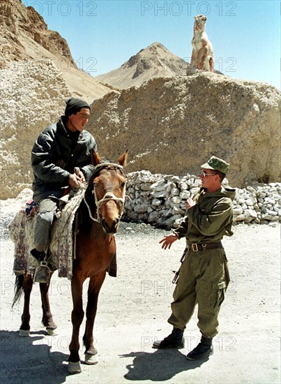 The tajik border with china, may 26, 2002, shepherds are frequent guests of the russian border guards serving in the high-altitude fronture post 'dzhamantal' in the tajik border on china which is more quiet than on afghanistan, but the outposts are located in mountain heights of 4000 metres above sea level, and border guards have to work in arctic climate under permanent lack of oxygen, on may 28 russia observes the day of border guard.