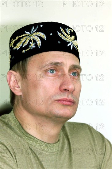 Kazan, tatarstan, russia, june 24 2000, russian president vladimir putin wearing a tatar embroidered skull-cap on his head seen attending an open-air holiday events organized outside kazan, sabantui has been traditionally celebrated as a plough holiday marking the end of sowing campaign, now it has become a national holiday marked all over the republic notwithstanding occupation or national identity.