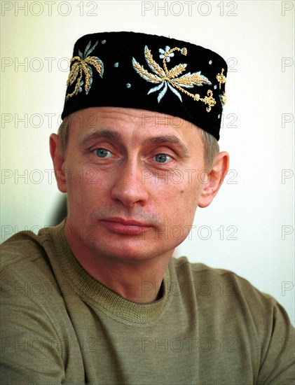 Kazan, tatarstan, russia, june 24 2000, russian president vladimir putin wearing a tatar embroidered skull-cap on his head seen attending an open-air holiday events organized outside kazan, sabantui has been traditionally celebrated as a plough holiday marking the end of sowing campaign, now it has become a national holiday marked all over the republic notwithstanding occupation or national identity.