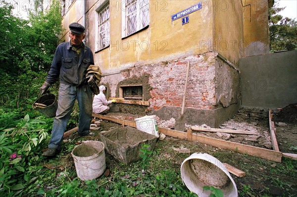 Urgent renovation of apartment building where russian president's mother-in-law ekaterina shkrebneva's lives in the town of baltijsk, kaliningrad, russia, july 21 2000, the house is being renovated because vladimir putin is coming to baltijsk to take part in a solemn celebration on navy day, cost of renovation: 610 thousand rubles.