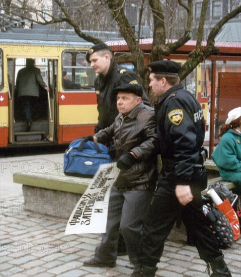 Riga, latvia, april 10 2001: russian citizen, resident of latvia, anatoly nautsevich, was arrested as he took part in unapproved demonstration in support of three other russian citizens, accused of terrorism for their protest action at the observation platform of the tower of st,peter's church in downtown riga, in november 2000, against latvian intentions to join nato.