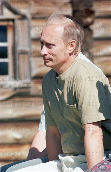 President putin visits kihzi island in karelia as part of his vacation tot he region 2001.