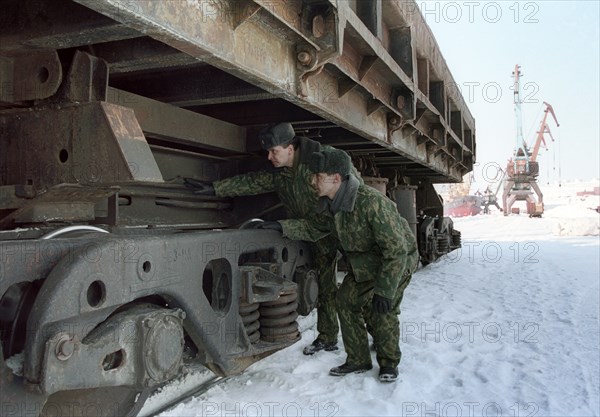 Customs inspectors in port of dudinka examine an incoming container at the docks, they are looking for smuggled nuclear material, krasnoyarsk region, russia.