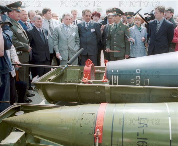 Kurgan region, june 9 2001: members of the russian governmental delegation, headed by vice-premier ilya klebanov (center), and foreign specialists viewing missile warheads, filled with chemical agents, on saturday, in the village of shchuchie, here the construction of a complex to scrap chemical weapons has began, in accordance with the inter-governmental agreement, (photo itar-tass/andrei gorelovsky).