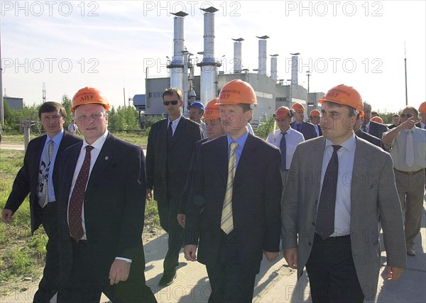Khanty-mansiysk autonomous region, russia 2001: 'gazprom' chairman of board alexei miller (c) touring enterprises, belonged to 'tyumentransgaz' company in the town of yugorsk, the new chairman was accompanied by general director of 'tyumentransgaz' pavel zavalny and deputy chairman of regional administration on the use of mineral resourses, vladimir karasev.