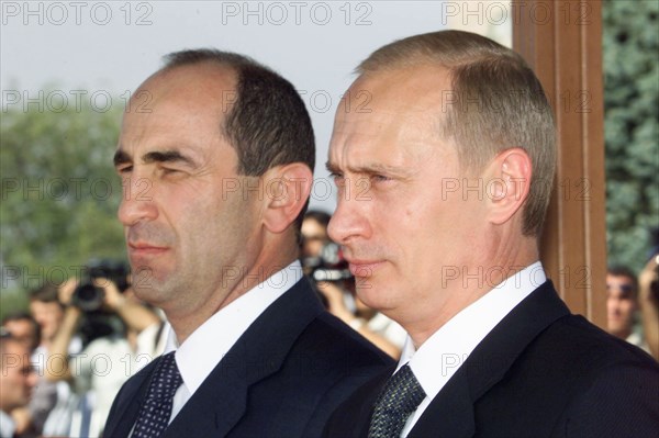 Yerevan, armenia, september 14, 2001, russian president vladimir putin (r) and his armenian counterpart robert kocharyan pictured during an official welcoming ceremony upon the arrival of russian head of state at the airport of yerevan on friday.