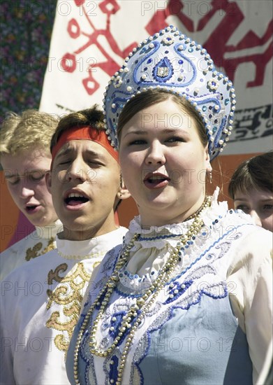 Tatarstan, russia, elvira fazlutdinova, the soloist of the 'ivushka' folk ensemble from kazan, performing at the karavon festival held in the village of russkoye nikolskoye on may 27, 2002, the day of saint nicholas, tatars.