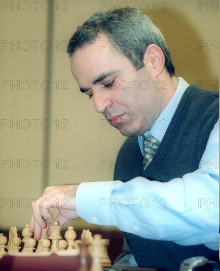 Chess grandmaster garry kasparov playing at the second round of the fide grand prix held in the international trade center early in june 2002.