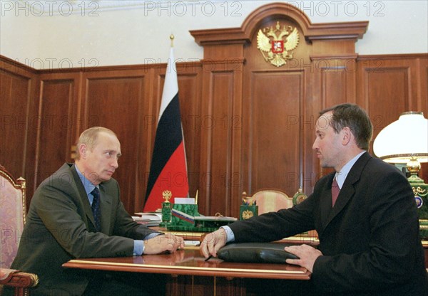 Kremlin, moscow, russia, june 19 2002: president of russia vladimir putin (l) and president of sberbank aleksey kazymin (r) discussed the sberbank performance in the year 2001 and preparations for the annual shareholders' meeting,  / sergei velichkin).