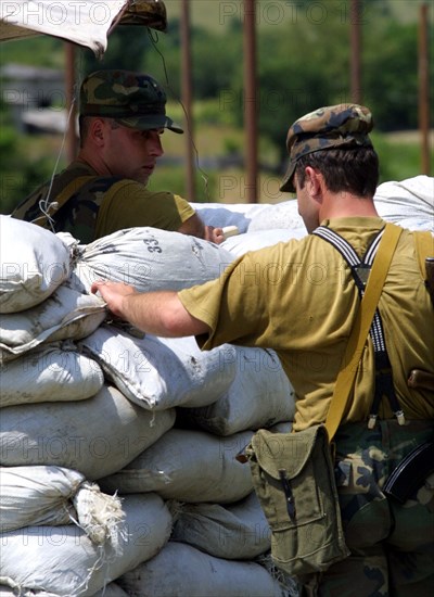 Georgia, august 7 2002: georgian border guards on duty at a checkpoint at the edge of pankisi gorge, stronghold of chechen seperatists.