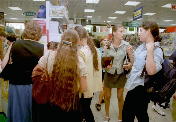 Moscow high school students shopping in a school supply store on new arbat street, moscow, 2002.