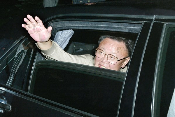 North korean leader kim jong-il waves his hand prior to the departure from vladivostok, russia, on friday, 8/23/02 .