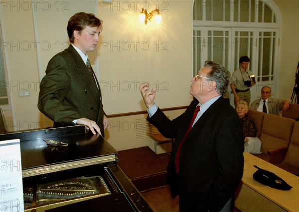 Famous russian opera singer vladimir atlantov (right) teaching danlll sokolov, third year student at the st, petersburg conservatory, st,petersburg, russia, september 12 2002.
