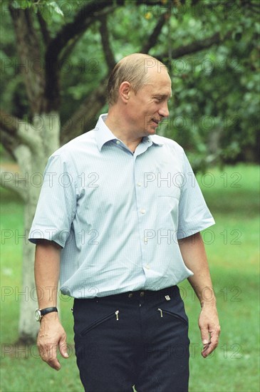Russian president vladimir putin strolling in presidetnial residence novo-ogaryovo in july 2002.
