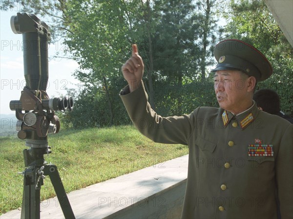 North korean border guard on the frontier with south korea at an observation post, 2002.