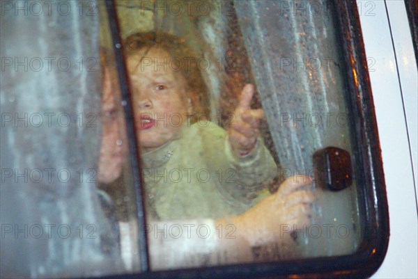 Moscow, russia, 10/23/02: some children (seen in a bus) were allowed to leave the building of the palace of culture of the ball-bearing plant which had been seized by terrorists, on wednesday, according to the hostages released from the building, there are about 15 terrorists there, most of them are armed.