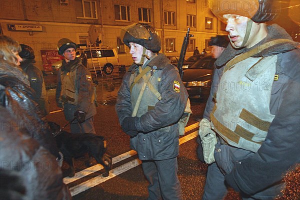 Moscow, russia, october 24 2002: anti-riot policemen at the entrance to the building of the palace of culture of the ball-bearing plant which had been seized by armed terrorists, on wednesday, at 21,00 moscow time, some hundreds of hostages still remain in the building.