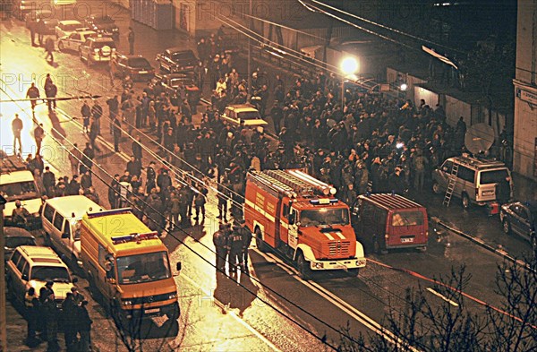 Moscow, russia, 10/24/02: a crowd of people in the square in front of the palace of culture seized by terrorists on wednesday evening, people, who had come to watch the musical play nordt-ost, were taken hostages there, omon and sobr anti-riot police units surrounded the place now.