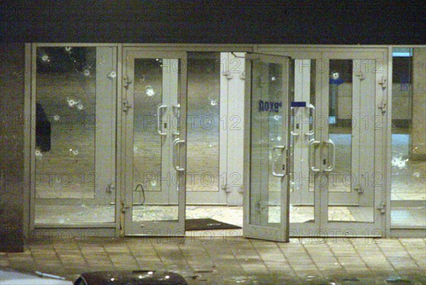 Moscow, russia, october 24 2002: picture shows the main entrance to the palace of culture riddled with bullet holes when terrorists seized the building on wednesday evening, people, who had come to see the musical play nordt-ost, were taken hostages there.