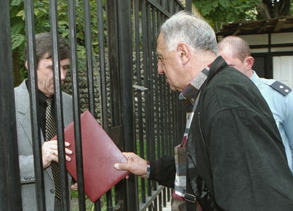 Tbilisi, georgia, october 25 2002: a representative of the georgian political movement 'ertoba' (unity) pictured handing a statement to an official of the russian embassy here on friday , the statement expresses support to the leadership and the people of russia in connection with the hostage crisis in moscow,  itar-tass- eye of georgia/ david khizanishvili ).