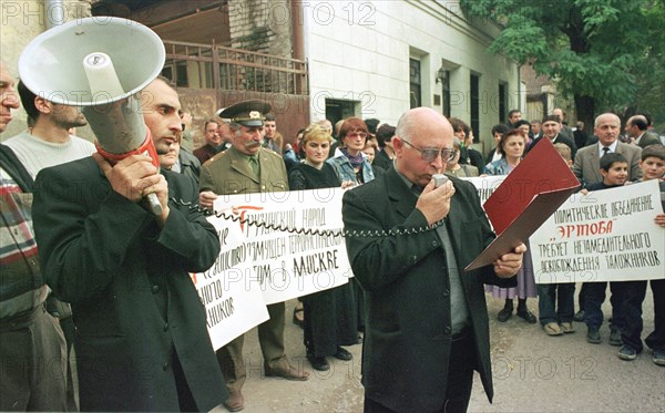 Tbilisi, georgia, october 25, 2002: a member of the political council of the 'ertoba' (unity) movement shota kvirtiya reading a statement in support of the leadership and the people of russia , the statement condemns the hostage-taking in moscow by terrorists.