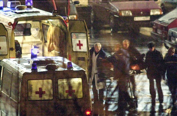Moscow, russia, october 26 2002: chechen hostage crisis: a dead body is brought to an ambulance, presumably it is the body of the man who entered the building tonight, probably a relative of a hostage.