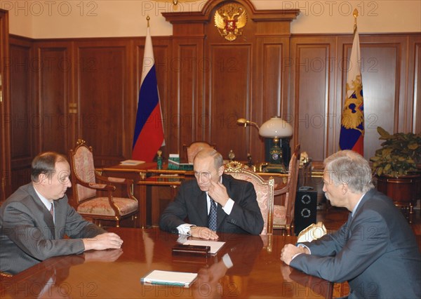 Moscow, russia,10/26/02, chechen hostage crisis: president vladimir putin (c) had a working meeting with federal security service chief nikolai patrushev (l) and interior minister boris gryzlov (r), they reported on the completion of the hostage release operation.