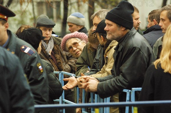 Moscow, russia,10/26/02: chechen hostage crisis: relatives of freed hostages take part in compiling list of names for passes into hospitals .