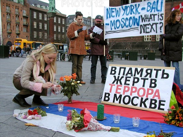 Copenhagen, denmark, october 29, 2002: demonstrators in downtown copenhagen on tuesday protest against the reluctance of danish government officials to do anything about the so-called world chechen congress that opened here monday, the action was organised by the union of russian-speaking societies of denmark, the poster reads 'in memory of terror victims in moscow,' (photo itar-tass / tatyana kulbitskaya).