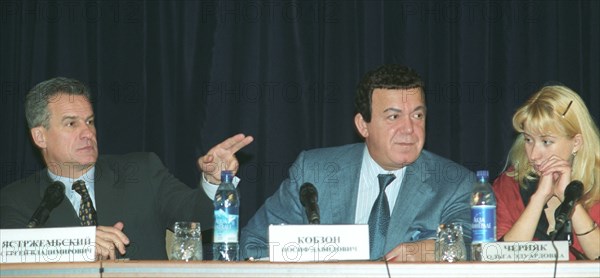 Moscow, russia, october 31 2002, left to right: presidential aide sergei yastrzhembsky, state duma deputy and singer iosif kobzon and an ex-hostage olga chernyak at the press conference about the recent hostage seige in moscow, explosive devices, arms, floor plans, slides and fragments of telephone conversations by the terrorists were presented at the conference that took place at the interior ministry of russia on thursday, (photo itar-tass / valentin kuzmin).
