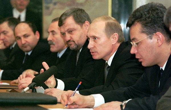 Moscow, russia, november 10 2002: right to left: special representative of the president of russia for ensuring human rights in chechnya abdul-khakim sultygov, president of russia vladimir putin, head of the chechen administration akhmat kadyrov, state duma deputy from chechnya aslanbek aslakhanov are pictured at the meeting that president putin held with chechen public and spiritual leaders on sunday.