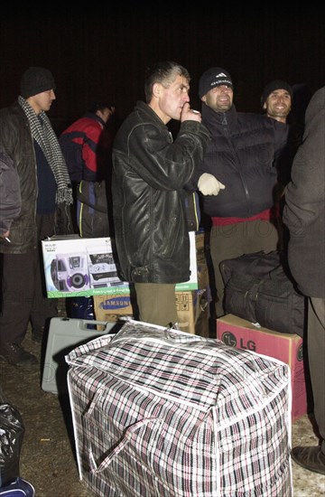 Moscow, russia, november 15 2002: tajik illegal immigrants (in pic) prior to their departure for chkalovsky airport for further deportation, the people's courts of khimki and podolsk districts took the decisions on the deportation of a group of tajik immigrants staying in moscow region without valid documents.