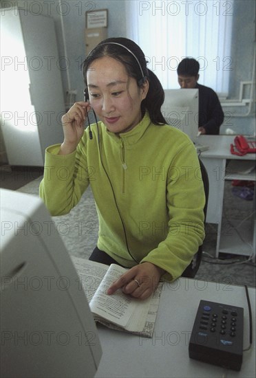 Phone operator yan linin receives a message from a subscriber to the only chinese language page company in the far east, 'china-page' is a joint russian-chinese venture launched by 'elektrosvyaz' and china's major page operator 'chinapage', vladivostok, russia, november 21 2002, the company's coverage includes the larger part of the maritime territory.