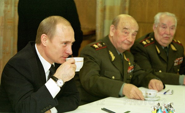 Moscow, russia, november 26 2002: (l-r) president of russia vladimir putin, marshal sergei sokolov, army general makhmut gareyev have tea together in the course of the meeting of president putin with army and fleet veterans following his meeting with russia's top military commanders held on tuesday, (photo sergei velichkin).
