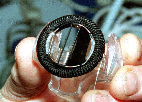 Belarus, december 3 2002: an artificial heart valve, the production of which has begun at the belarussian concern 'planar,' optical and space technology materials are used in its design, for instance, crystal carbon, which is biologically compatible with human blood, the valve's service life is calculated for 20 years which is several times longer than that of \the previous models, each valve has its own exploitation characteristics and a passport, (photo viktor tolochko) .