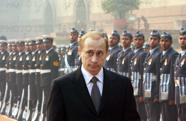 India, december 4 2002: president of russia vladimir putin (in pic) inspects the guard of honour in front of the presidential palace at the beginning of his official visit to india.