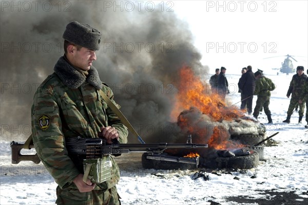 Tajikistan, december 6 2002: men of the moskovsky border detachment burning up packets containing the confiscated drugs with a total weight of 841,9 kilograms, on friday, the drugs were confiscated in the course of special operations held with the participation of over 300 servicemen, (photo sergei zhukov) .