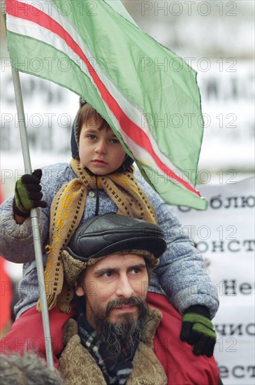 Moscow, russia, december 12, 2002: participants in the mass action 'demonstration for peace in chechnya: break the shameful circle of violence' (in pic) that took place on thursday, the participants in the action walked from arbat to pushkin square.