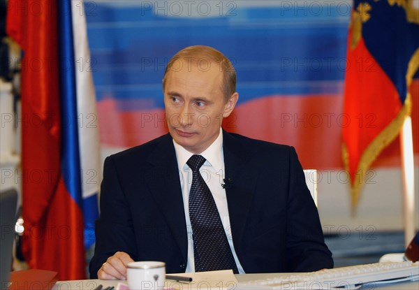Moscow, russia, december 19, 2002, russian president vladimir putin pictured during his live tv- and radio dialogue with russians, the dialogue was broadcast live by the first tv channel, the russia tv channel, the mayak and radio russia radio broadcasting stations.
