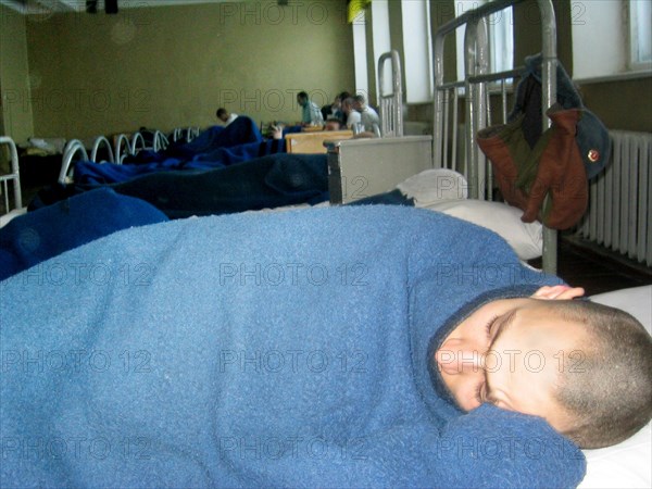 Vladimir region,russia, january 13 2003: an in-patient seen at the hospital of the training centre of moscow military district, more and more soldiers have been rushed here this january with the diagnosis acute human respiratory disease, (photo itar-tass / ivan petrov).