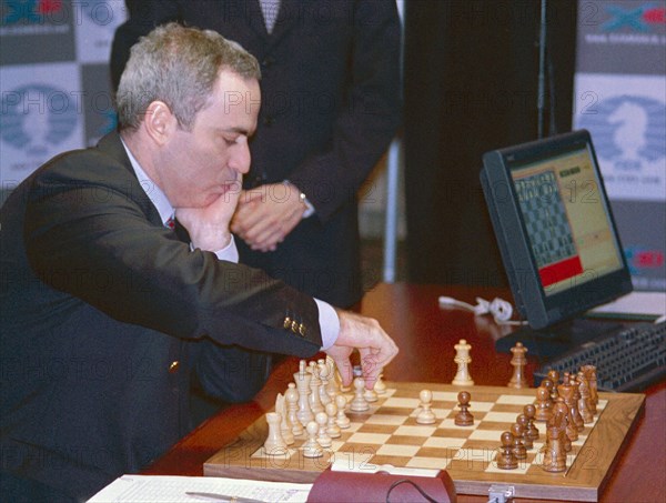 Russian chess player garry kasparov playing the white pieces in a match against the deep junior computer program, sunday, held on manhattan, it took kasparov 27 moves and almost four hours to beat deep junior in the opening round of their six-game match, new york, usa, january 27, 2003.