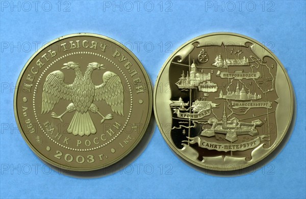 At the moscow mint, moscow, russia, january 29 2003, picture shows a memorial coin,dedicated to the 300th anniversary of st,petersburg, made at the moscow mint, this enterprise equipped with modern machinery manufactures different coins, including memorial ones, state medals and orders, different badges, jewels and some souvenir articles.