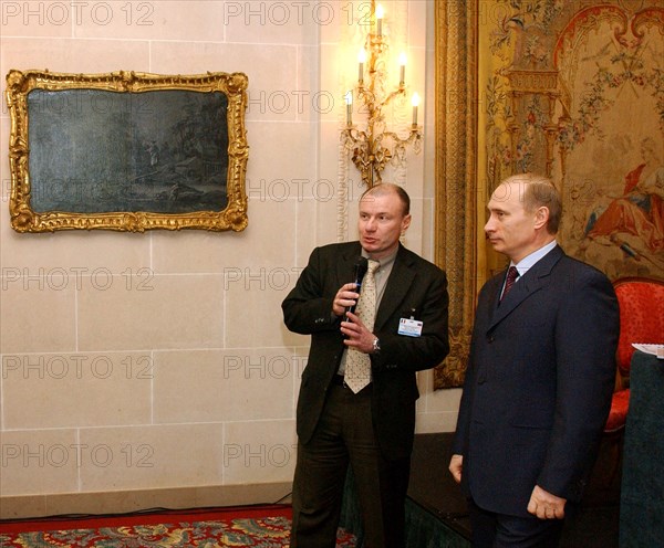 President of russia, vladimir putin (right) and president of the 'interros' company vladimir potanin (left) meeting in a lobby of the 'bristol' hotel, were vladimir putin stayed during his visit to france, a presentation of the russian-french cultural action, dedicated to the 300th founding anniversary of st,petersburg, was held here on tuesday, the action is to be held under the motto 'when russia spoke french, paris - st,petersburg, 1800 - 1830'.